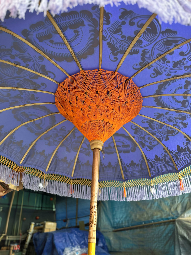 Luxury Charlotte Parasol featuring a lavender canopy with gold accents and a hand-carved bamboo pole for garden décor.
