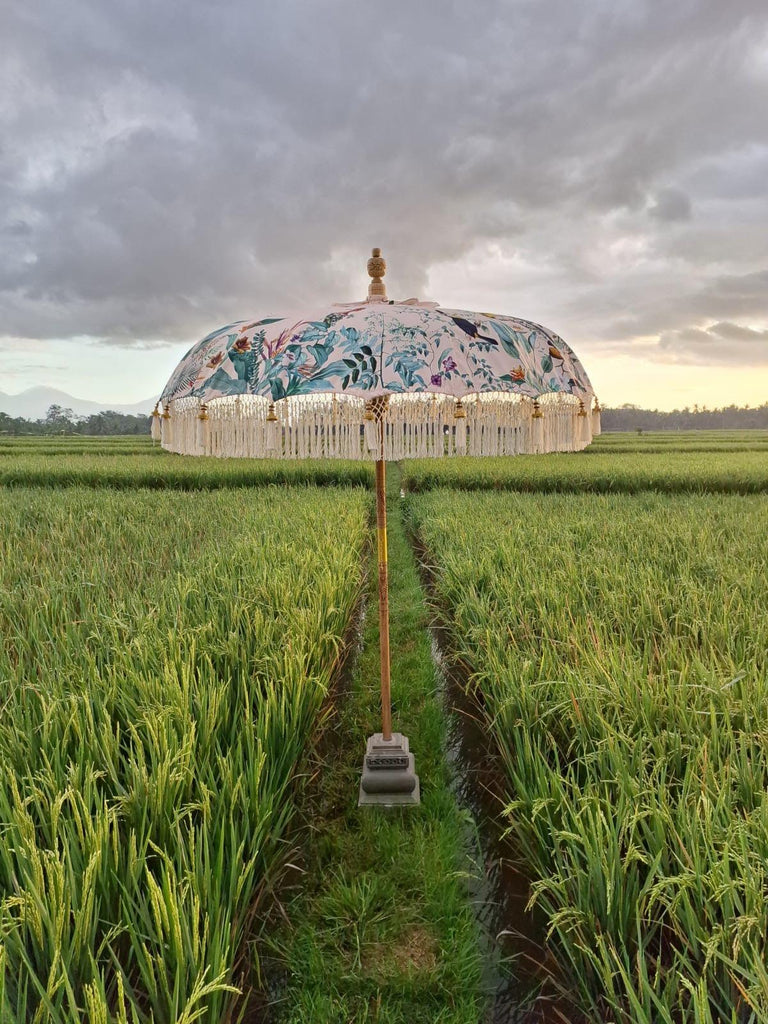 Elegant Birdie Parasol with colorful birds and greenery design, perfect for stylish outdoor settings.